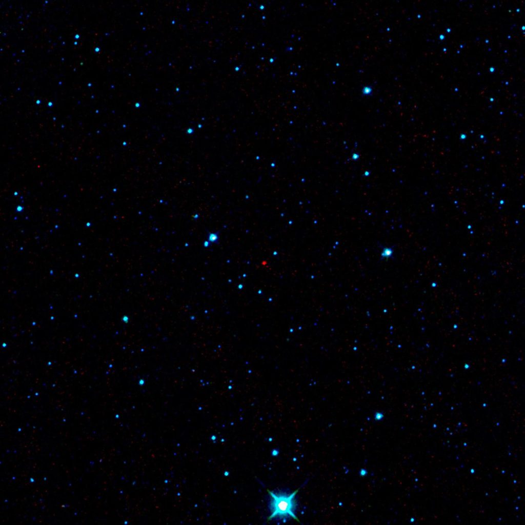 asteroid tumbling against a star field